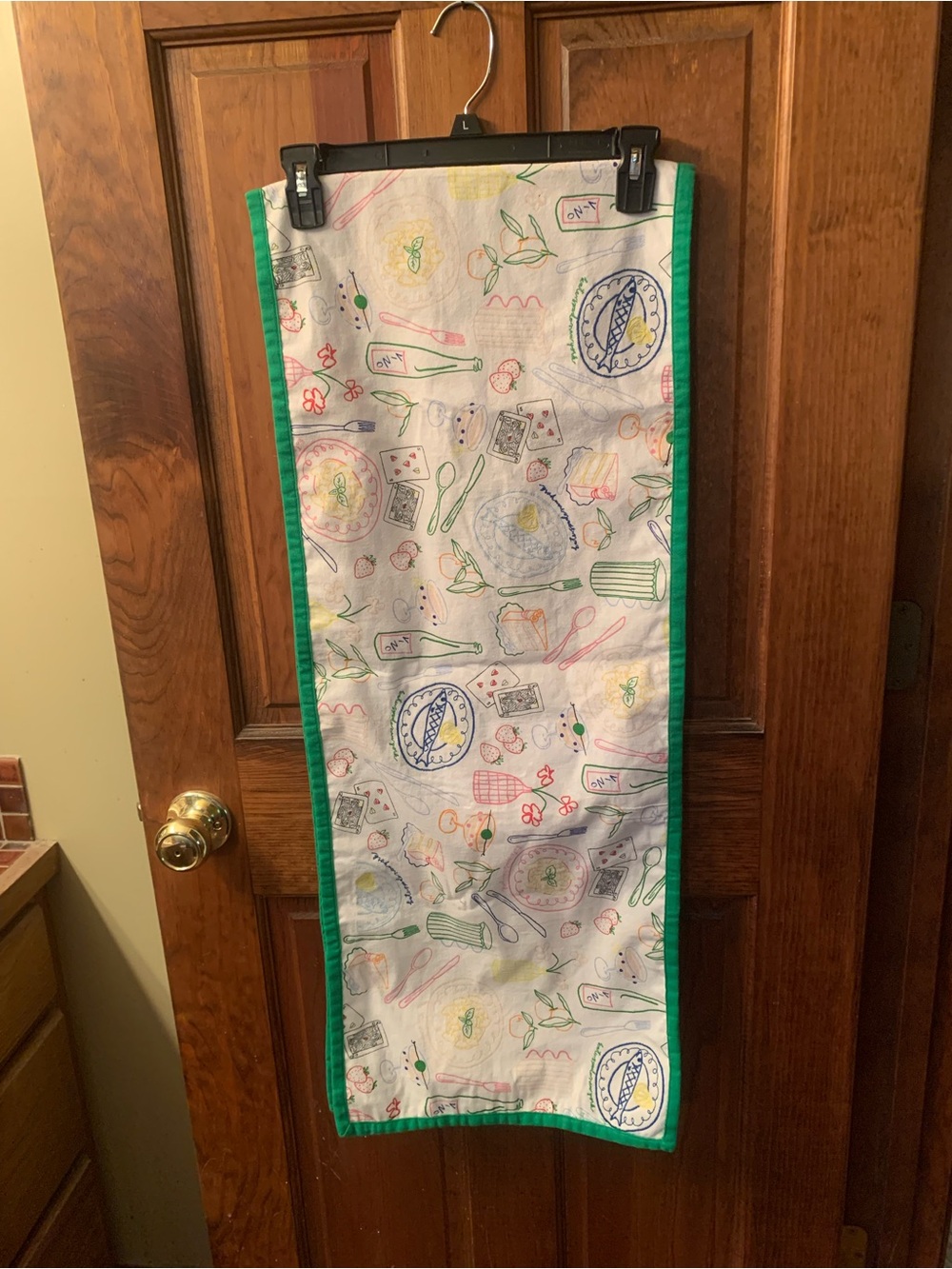 KATE SPADE New York party print table runner, 14 inches wide and 72 inches long.